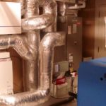 HVAC installation featuring ductwork and heating equipment, showcasing Atlantic Heating & Air Conditioning's expertise in heating and cooling solutions.