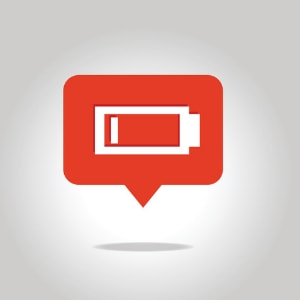 Battery icon in a red speech bubble, symbolizing low freon levels in air conditioning systems and the need for professional recharge services.