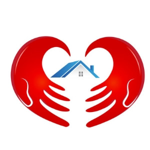 Red hands forming a heart shape around a blue house, symbolizing care and comfort in home HVAC services offered by Atlantic Heating & Air Conditioning.