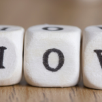 Wooden dice displaying 'L,' 'O,' and 'V' for love, connecting to Atlantic Heating & Air Conditioning's service theme.