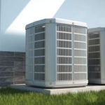 Two air conditioning units on concrete, highlighting modern design by Atlantic Heating & Air Conditioning.