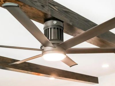 Ceiling fan with modern design and integrated light fixture, showcasing energy-efficient cooling solutions for reducing heating and cooling costs.