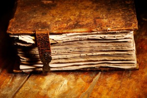 Old, weathered book with a leather cover and clasp, symbolizing the history of home heating systems and HVAC evolution.